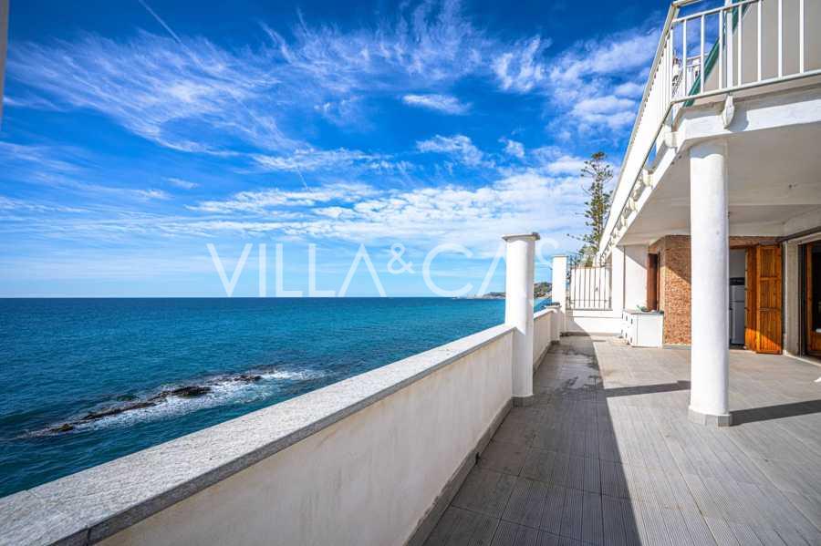 Two-story apartment with a private beach in Italy.